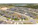 Aerial view of a community with lake views and many single-Gathering homes at 6935 Dilly Lake Ave, Groveland, FL 34736