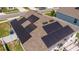Aerial view of home with solar panels, pergola, and outdoor patio at 6935 Dilly Lake Ave, Groveland, FL 34736