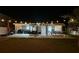 Relaxing backyard offers patio, seating, grill and hammock under cafe lights at 6935 Dilly Lake Ave, Groveland, FL 34736