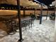 Relaxing backyard offers patio, pergola, seating, and outdoor dining under festive cafe lights at 6935 Dilly Lake Ave, Groveland, FL 34736