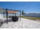 Spacious backyard featuring a paved patio, and well-maintained lawn at 6935 Dilly Lake Ave, Groveland, FL 34736