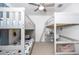 bedroom featuring two sets of bunkbeds, ceiling fan, and carpeted floors at 6935 Dilly Lake Ave, Groveland, FL 34736
