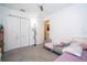 Neutral bedroom with two beds, carpet, and closet at 6935 Dilly Lake Ave, Groveland, FL 34736