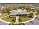 Aerial view of a community pool and recreation center with palm trees at 6935 Dilly Lake Ave, Groveland, FL 34736