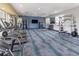 Modern gym featuring treadmills, free weights, and weight machines for a complete fitness experience at 6935 Dilly Lake Ave, Groveland, FL 34736