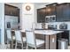Modern kitchen boasts dark cabinets, white countertops, and stainless steel appliances at 6935 Dilly Lake Ave, Groveland, FL 34736