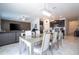Open-concept living room and kitchen with modern finishes and ample natural light at 6935 Dilly Lake Ave, Groveland, FL 34736