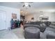 Open floor plan featuring a living room, bar, and kitchen with easy access at 6935 Dilly Lake Ave, Groveland, FL 34736