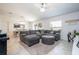 Comfortable living room with a large sectional sofa and open floor plan at 6935 Dilly Lake Ave, Groveland, FL 34736