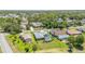 Aerial view of a neighborhood with mature trees and landscaping surrounding well-maintained homes and yards at 71 Lazy Eight Dr, Port Orange, FL 32128