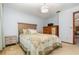 Cozy bedroom with a comfortable bed, side tables, and ample storage, creating a relaxing retreat at 71 Lazy Eight Dr, Port Orange, FL 32128