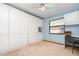 Functional bedroom with built-in storage, a work desk, and a window that offers natural light at 71 Lazy Eight Dr, Port Orange, FL 32128