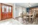Elegant dining room featuring wood floors, a decorative hutch, and seating for six at 71 Lazy Eight Dr, Port Orange, FL 32128