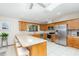 Bright kitchen with stainless steel appliances, granite countertops, and a convenient breakfast bar at 71 Lazy Eight Dr, Port Orange, FL 32128
