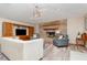 Cozy living room featuring brick fireplace, comfortable seating, and custom built-ins at 71 Lazy Eight Dr, Port Orange, FL 32128