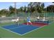Pickleball court in use, showing a vibrant and well-maintained recreational area for residents at 71 Lazy Eight Dr, Port Orange, FL 32128