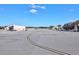 Wide view of the neighborhood runway adjacent to hangars and parking, offering ease of access for planes at 71 Lazy Eight Dr, Port Orange, FL 32128