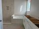 Modern bathroom with a tiled shower, bathtub, and vanity awaiting finishing touches at 738 Pointe Emerson Blvd, Apopka, FL 32703