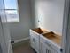 Bathroom featuring an unfinished vanity with sleek hardware, complemented by a window, awaiting your personal touch at 738 Pointe Emerson Blvd, Apopka, FL 32703