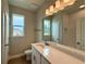 Bathroom with vanity, toilet, and shower at 738 Pointe Emerson Blvd, Apopka, FL 32703