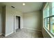 Bright bedroom with plush carpet, closet, and a large window letting in plenty of natural light at 738 Pointe Emerson Blvd, Apopka, FL 32703