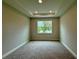 Bedroom with a tray ceiling and a window view at 738 Pointe Emerson Blvd, Apopka, FL 32703