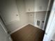 Efficient laundry room with overhead cabinets and space for washer and dryer at 738 Pointe Emerson Blvd, Apopka, FL 32703