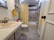 Charming bathroom with a tub, updated fixtures, and a clean, neutral color scheme at 741 Truman Ave, Lady Lake, FL 32159