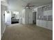 Well-lit bedroom with a ceiling fan and practical built-in storage solutions at 741 Truman Ave, Lady Lake, FL 32159
