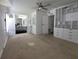 Cozy bedroom featuring a ceiling fan and built-in shelves and drawers for ample storage at 741 Truman Ave, Lady Lake, FL 32159