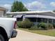 Charming single-story home with awnings and landscaped yard at 741 Truman Ave, Lady Lake, FL 32159