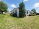The home's exterior is enhanced with lush greenery and manicured landscaping at 741 Truman Ave, Lady Lake, FL 32159