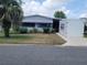Charming single-story home featuring a well-maintained lawn, mature landscaping, and a bright exterior at 741 Truman Ave, Lady Lake, FL 32159
