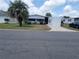 Charming single-story home featuring a well-maintained lawn, mature landscaping, and a bright exterior at 741 Truman Ave, Lady Lake, FL 32159