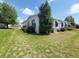 The home's exterior is enhanced with lush greenery and manicured landscaping at 741 Truman Ave, Lady Lake, FL 32159