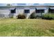Well-kept lawn and exterior showcasing the well-maintained landscaping around this single Gathering home at 741 Truman Ave, Lady Lake, FL 32159