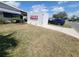 Landscaped front yard of this single Gathering home showing the well-kept lawn and curb appeal at 741 Truman Ave, Lady Lake, FL 32159