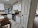 The kitchen boasts ample counter space, stainless steel appliances and white cabinets at 741 Truman Ave, Lady Lake, FL 32159