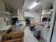 Cozy kitchen area featuring updated appliances and countertops, and convenient storage solutions at 741 Truman Ave, Lady Lake, FL 32159