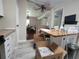 Bright kitchen featuring white cabinets and stylish wood-look flooring, with boxes from moving at 741 Truman Ave, Lady Lake, FL 32159