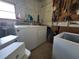 Laundry room with washer, dryer, peg board, and storage at 741 Truman Ave, Lady Lake, FL 32159
