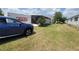 A view of the side yard next to a PODS moving and storage container at 741 Truman Ave, Lady Lake, FL 32159