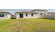 Spacious backyard with lush green grass, perfect for outdoor activities at 849 Teton St, Haines City, FL 33844