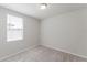 Cozy bedroom with neutral carpet, a window bringing in natural light, and freshly painted walls at 849 Teton St, Haines City, FL 33844