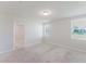 Well-lit bedroom featuring plush carpeting and two large windows at 849 Teton St, Haines City, FL 33844