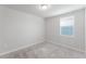 Simple bedroom featuring carpet and a window for natural light at 849 Teton St, Haines City, FL 33844