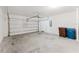 Clean, spacious two car garage featuring an automatic door and ample storage, a homeowner's dream at 849 Teton St, Haines City, FL 33844
