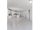 Bright kitchen with island, stainless appliances, and white cabinets at 849 Teton St, Haines City, FL 33844
