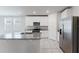 Modern kitchen with a central island, stainless steel appliances, and granite countertops at 849 Teton St, Haines City, FL 33844