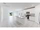 Bright kitchen features white cabinets, granite countertops, and stainless steel appliances at 849 Teton St, Haines City, FL 33844